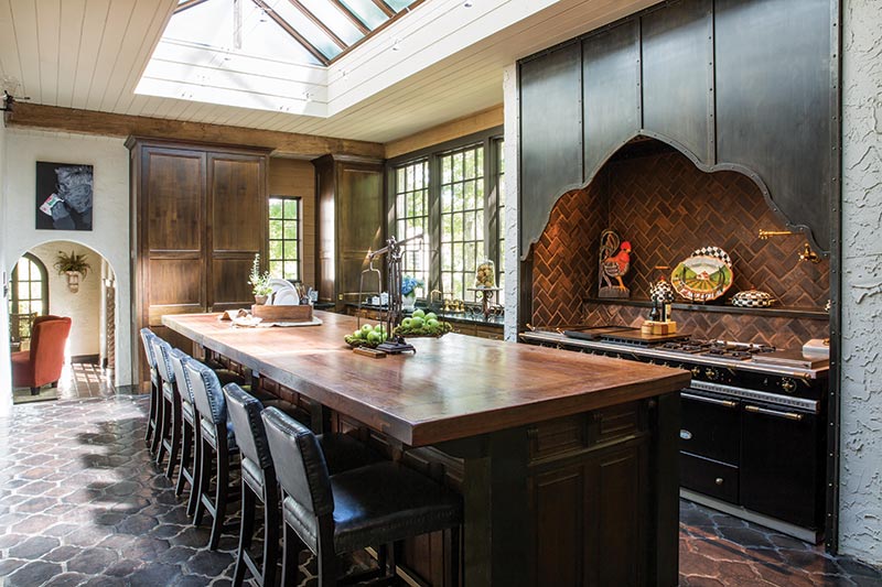 Large rustic kitchen with copper skylight