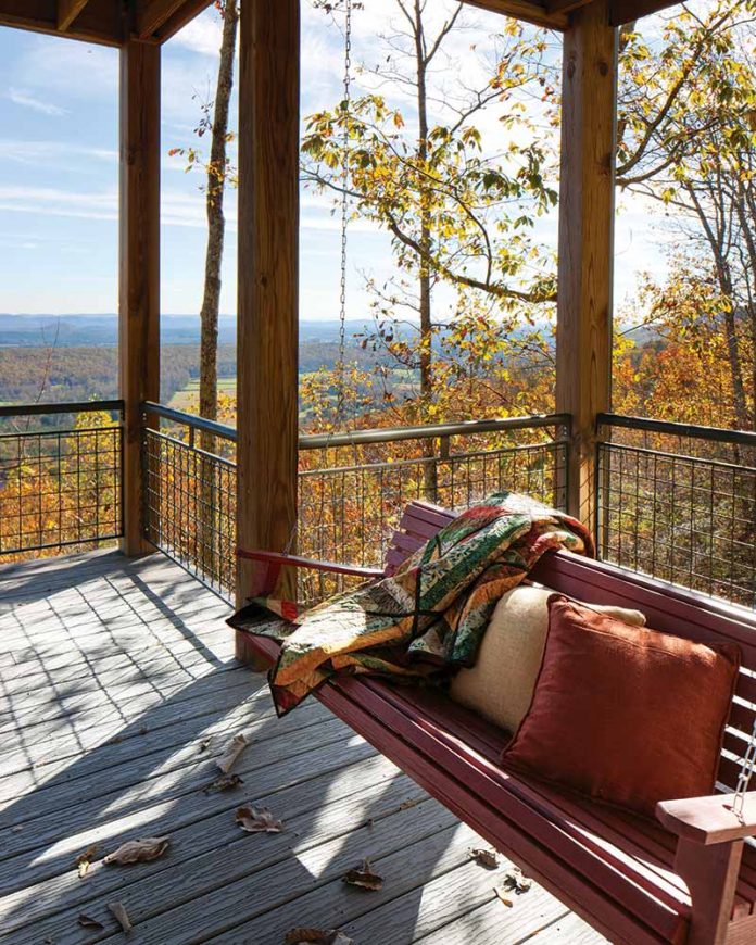 Porch swing overlooking autumn forrest