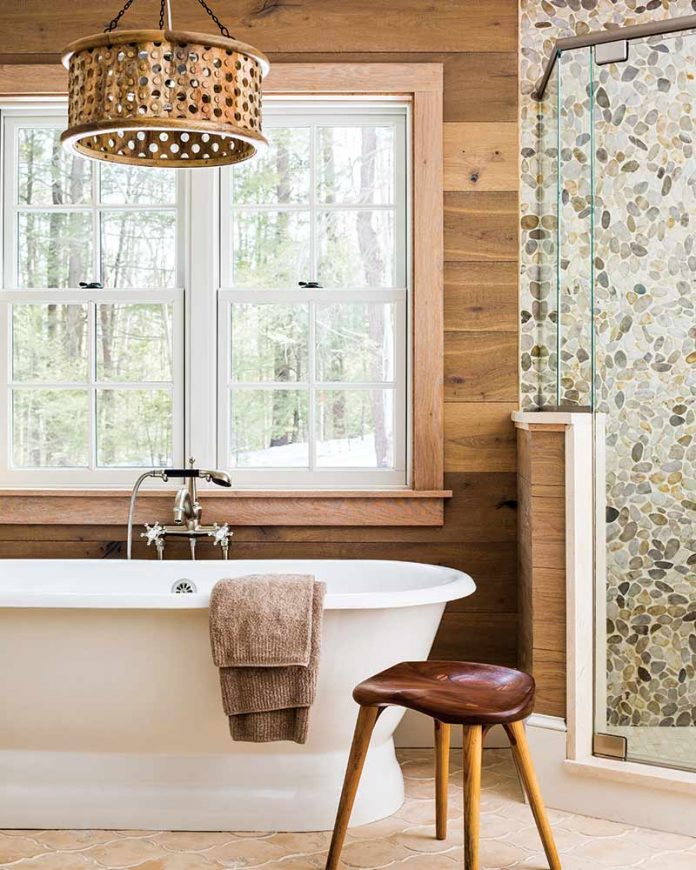 bathroom with dark wood shiplap and soaking tub