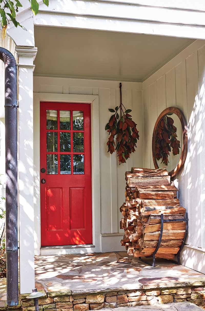 red front door and fire wood
