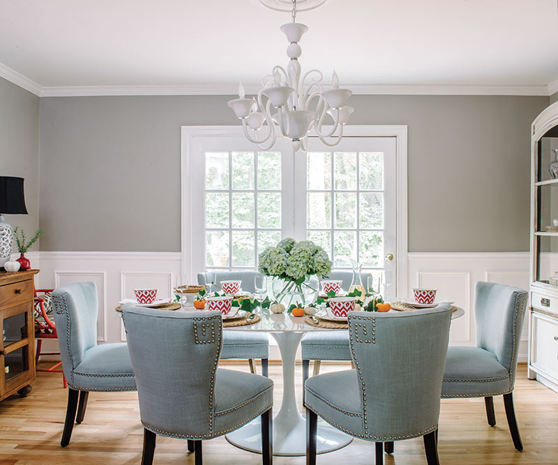 autumn dining room with greige walls and baby blue chairs