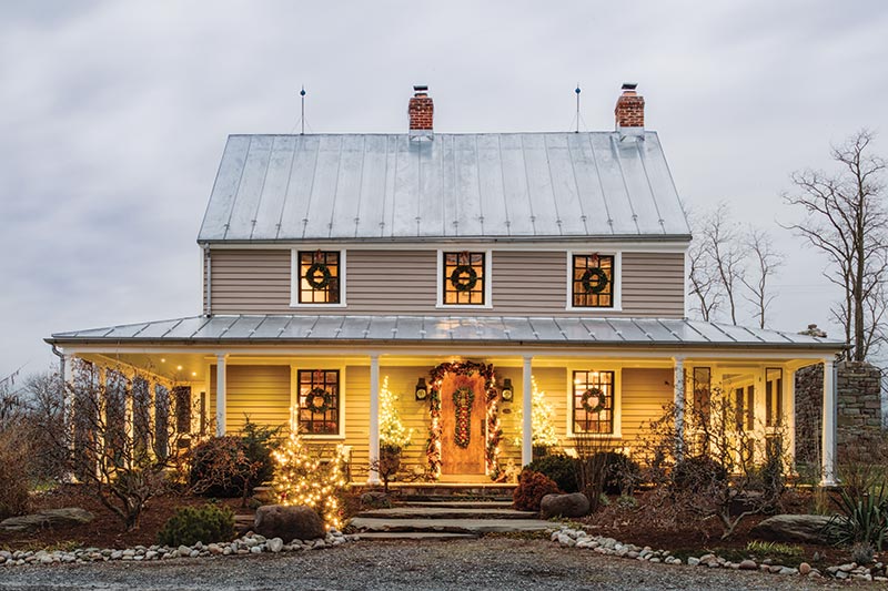 Farmhouse exterior with Christmas lights