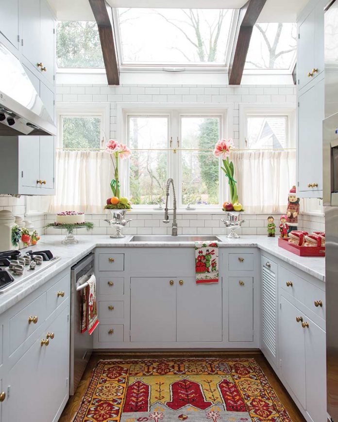 Quaint Christmas cottage kitchen with skylight and light gray cabinets