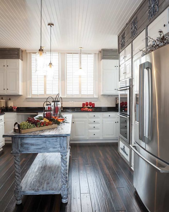 White kitchen with gray wooden island