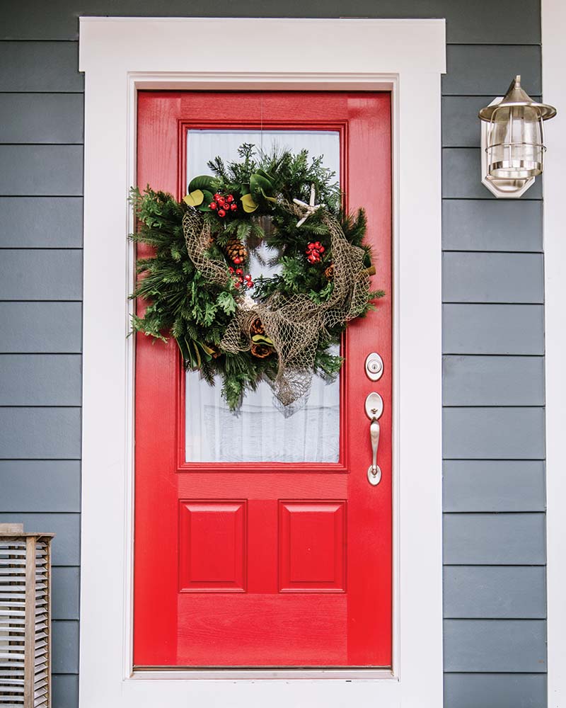 Red front door with nautical wreath
