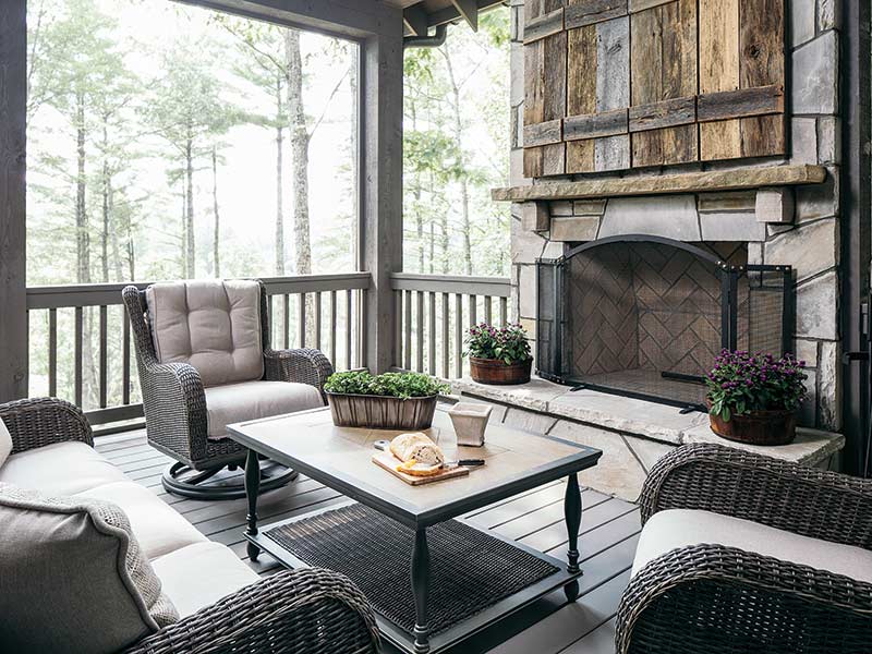 mountain home screened-in patio with fireplace
