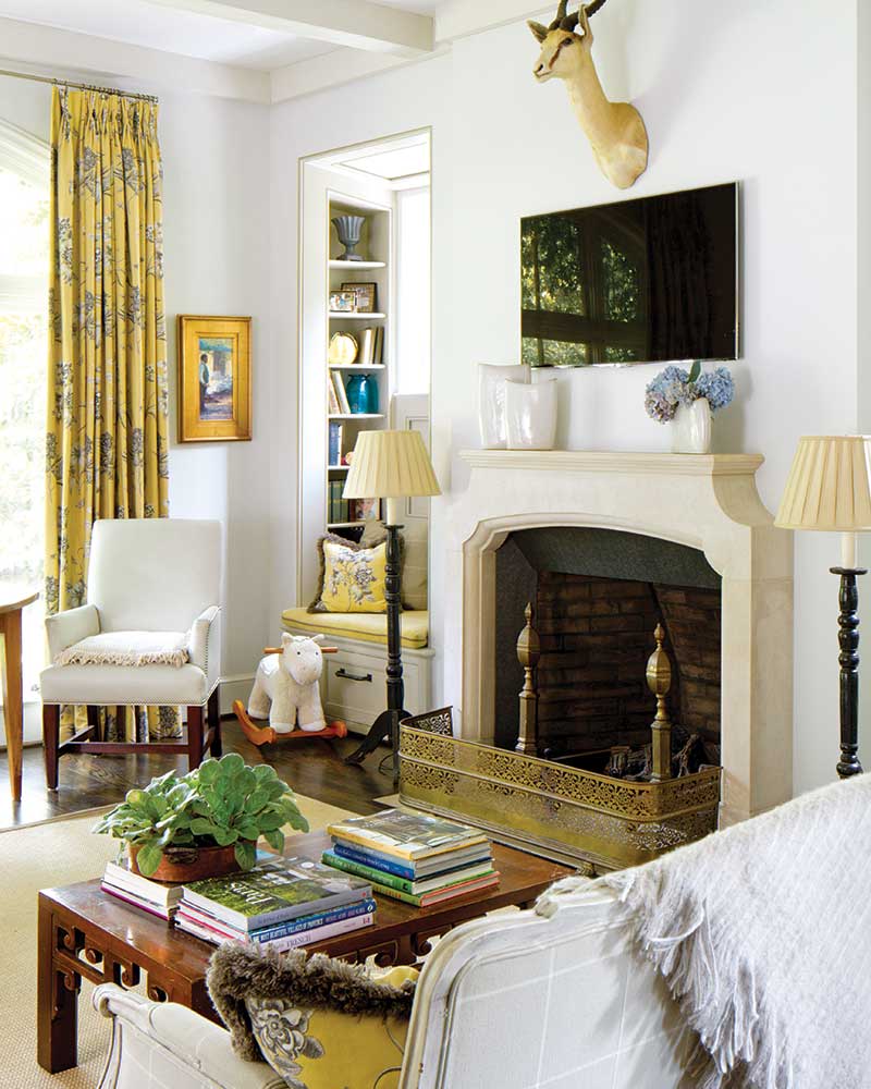 French-inspired sitting room with yellow accents and window seat
