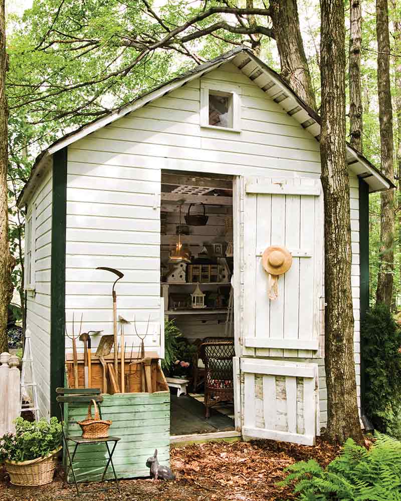 small white rustic garden shed 