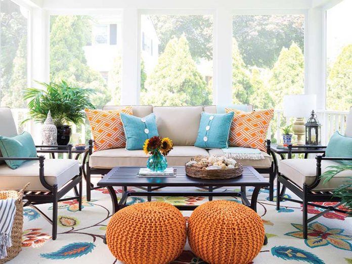 sunroom with vibrant orange hues paired with sea blues
