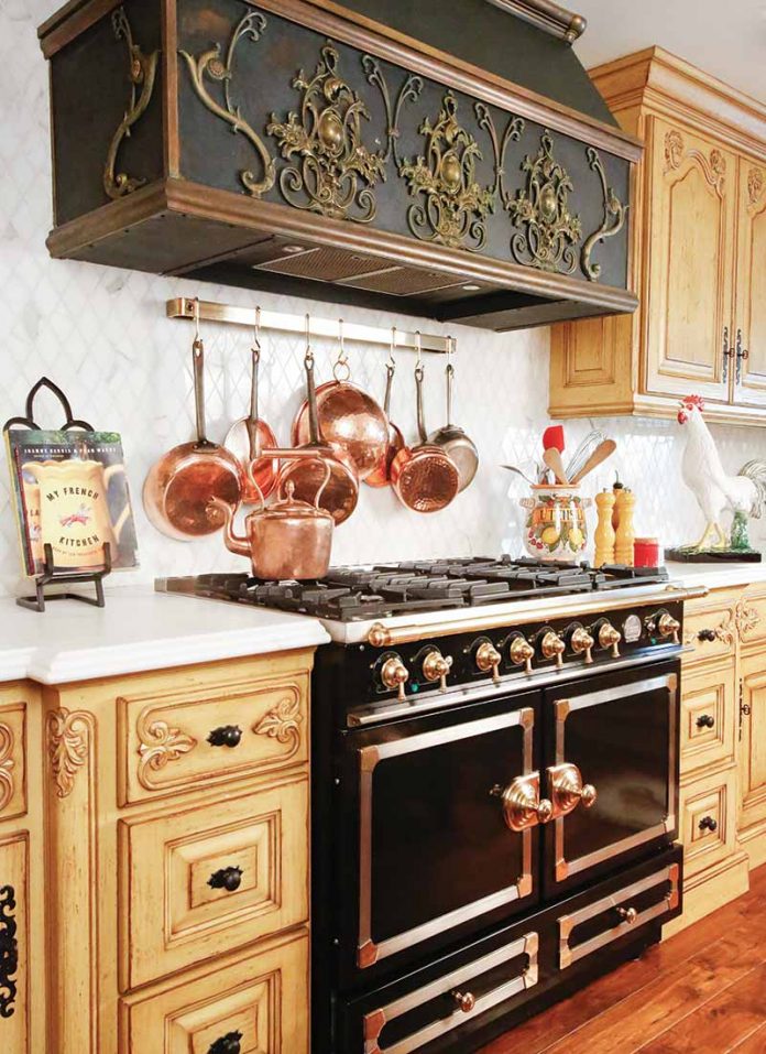 French-style range in black with gold finishes