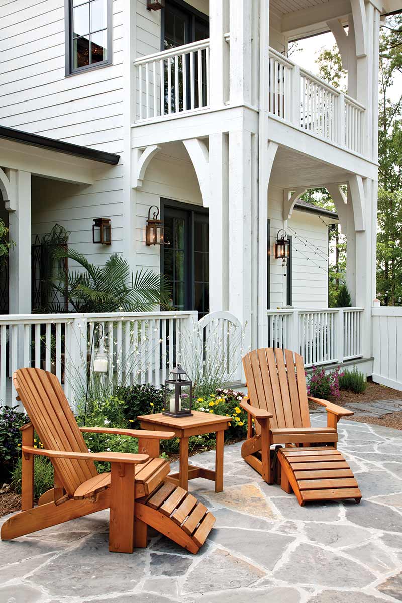 lounge chairs outside of white home