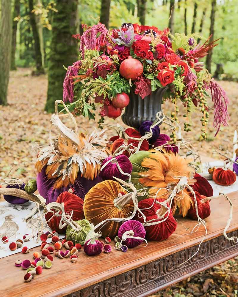 A tabletop vignette with velvet pumpkins and acorns.