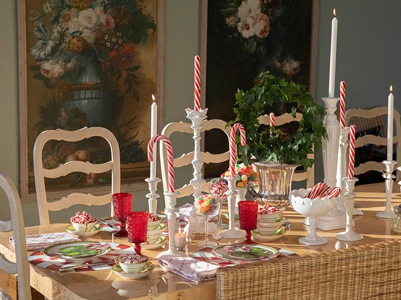 A table setting with red goblets. 