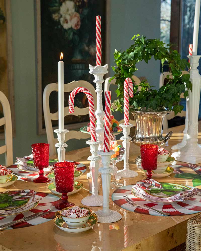 Oversize candy canes in ceramic candle holders. 