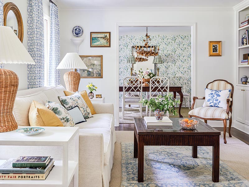 A living room with a blend of furnishings, woven accents, and patterned fabrics.