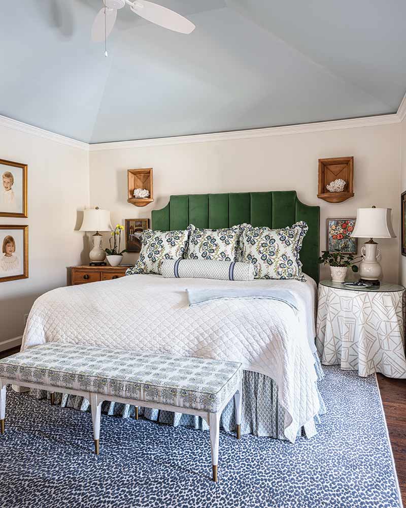 A bedroom with a sky-blue painted ceiling.