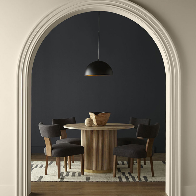A dining room painted Behr's Black Pepper.
