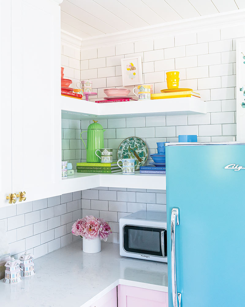 A corner kitchen nook decorated with colorful dishware. 