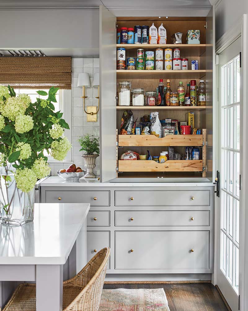 A kitchen with custom cabinets for organization. 