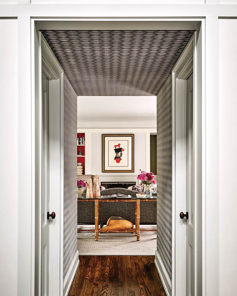 A hallway with wallpaper. 