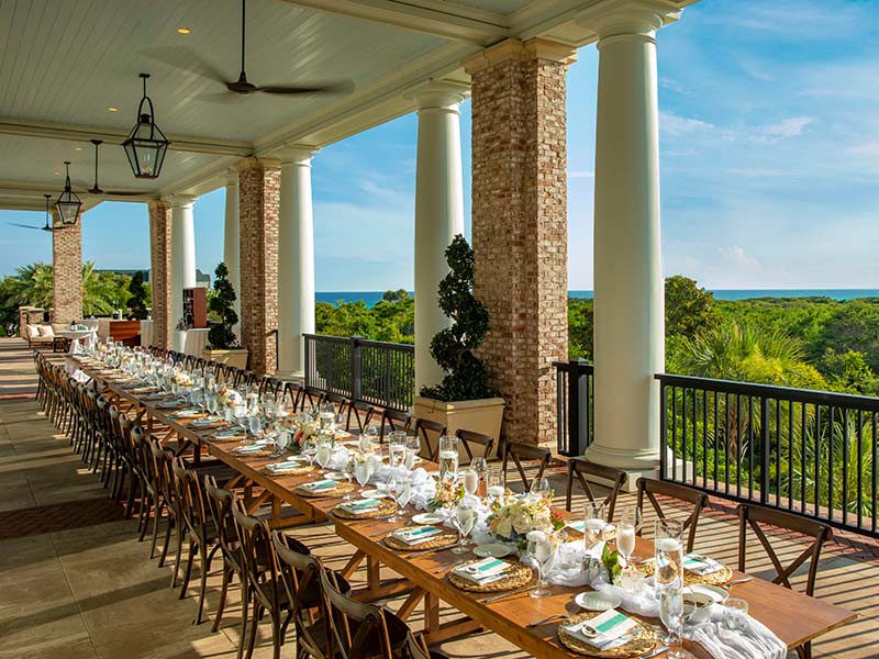 A long table set for dinner on the terrace.