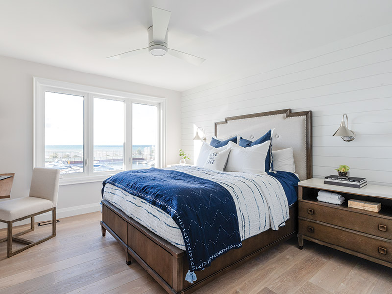 Bedroom with blue and white decor. 