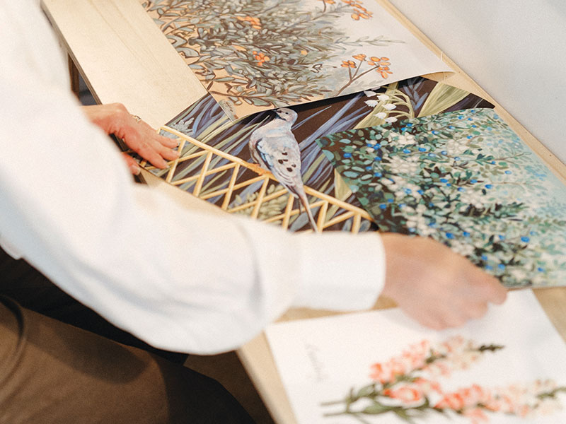 Artist Meredith Raiford working in her art studio. 