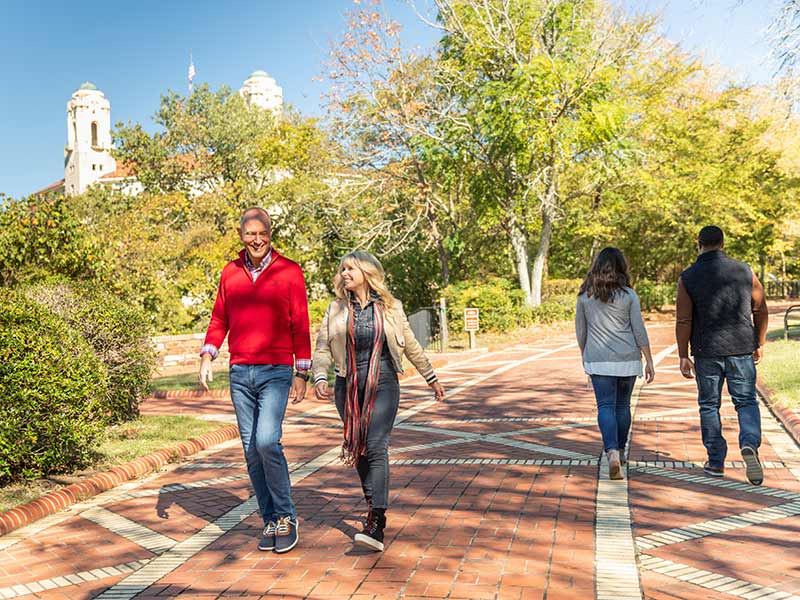 Tourists walking along the park walkway in Hot Springs, Arkansas.