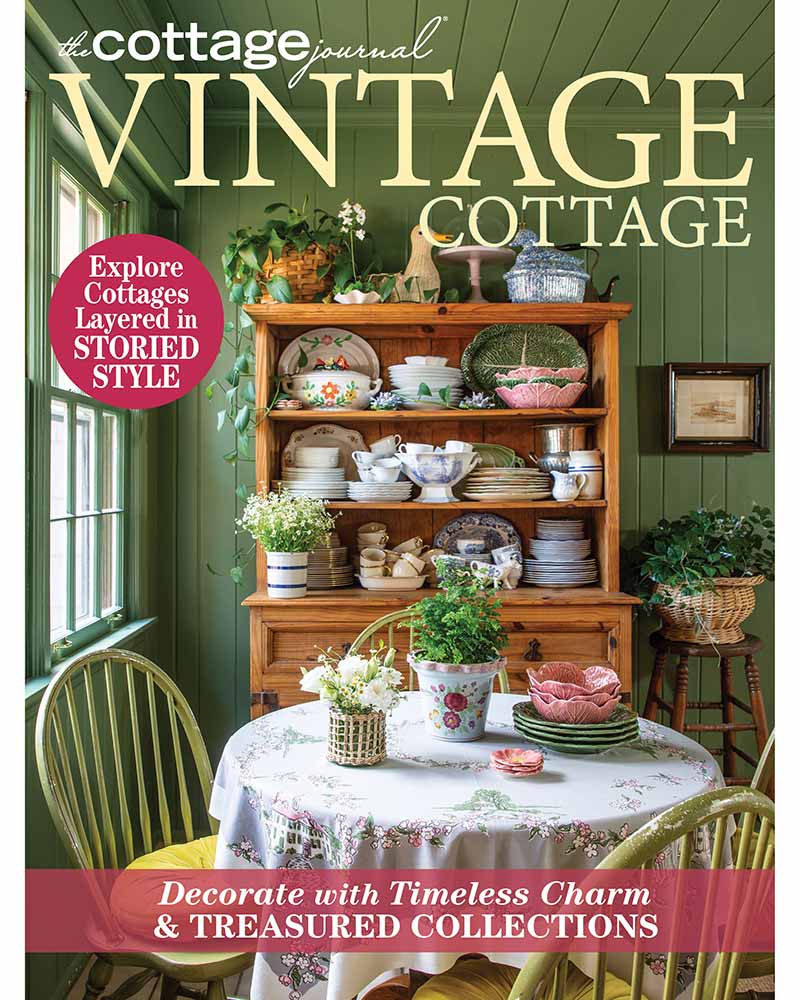 Cover of 2024 Vintage Cottage special issue. Features a breakfast nook with a pine hutch filled with collected dishware.