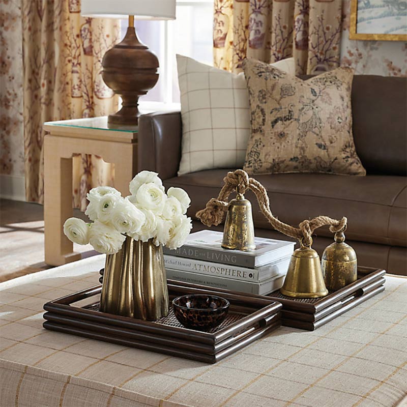 Bamboo trays styled on an ottoman.