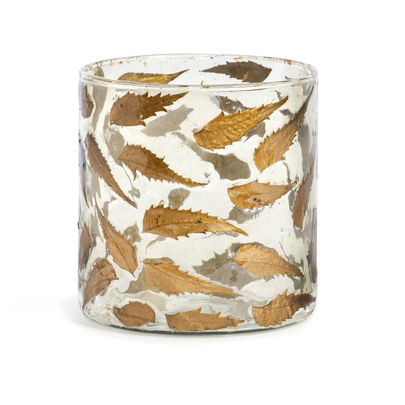 A glass hurricane with bronze leaves.