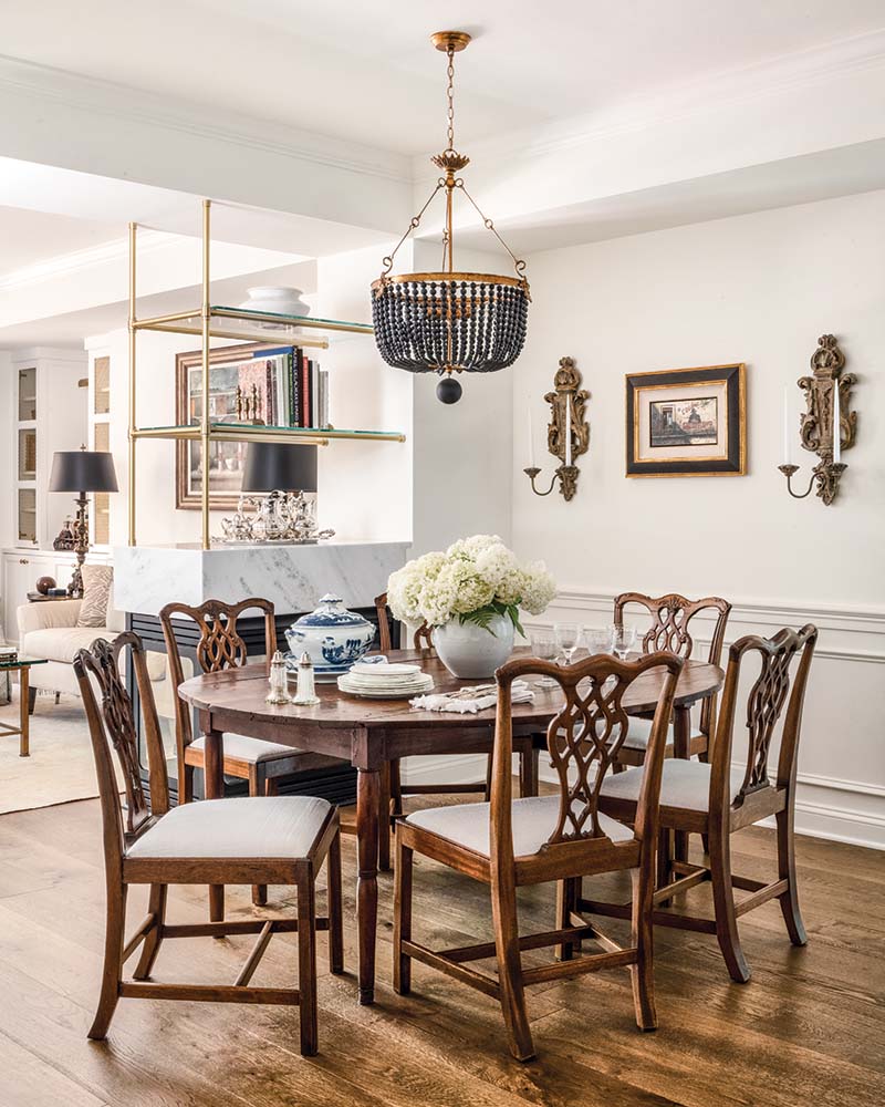 A beaded chandelier adds definition to the dining area of the open floor plan.