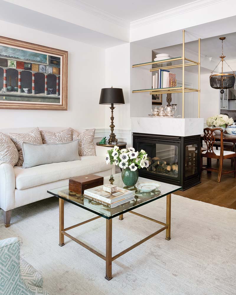 The redesigned fireplace adds visual separation between the living and dining areas.