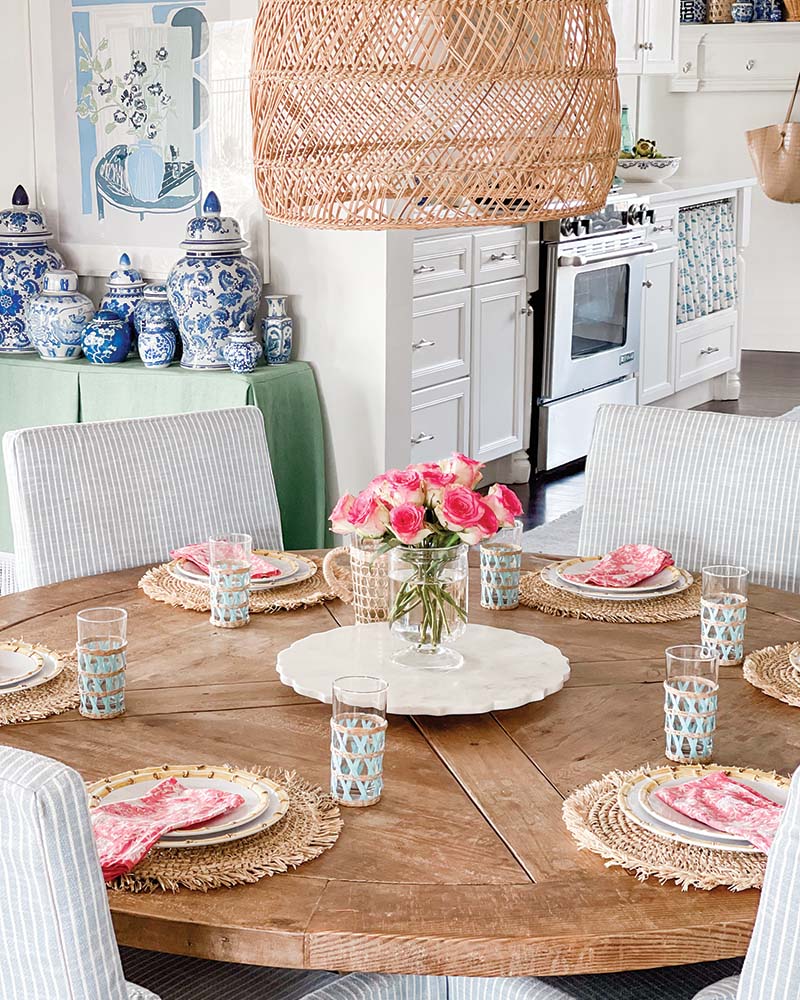 Because the Yorks are often hosting—something they do around the wooden pedestal table that can seat up to eight—the dining chairs were re-covered in a performance fabric, and Maggie’s collection of chinoiserie ginger jars serves as a backdrop for dinner parties.