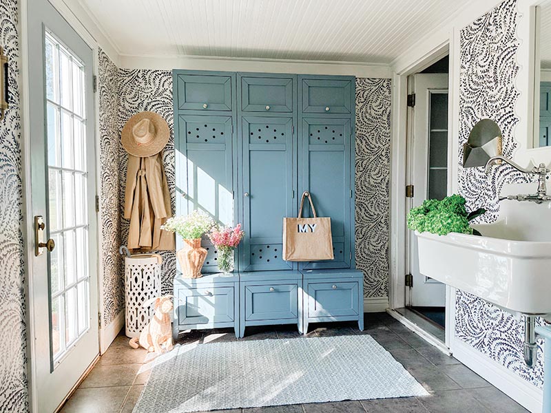 In addition to highlighting original elements like the ceiling in the mudroom, the design translates classic essentials in a relaxed way, using block-print drapes to lend color and complementing antique-style picture frames with caned counterparts.
