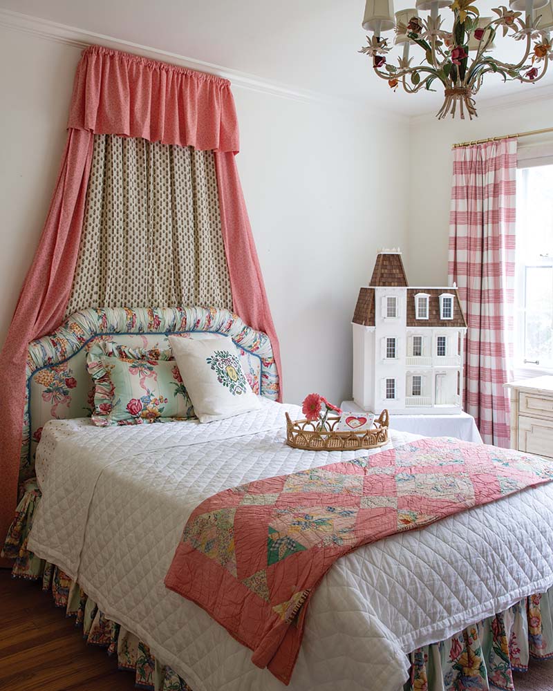 Drawing from their Scottish family lineage of the Burnett family, Zoe’s bedroom is inspired by notable author Frances Hodgsen Burnett’s The Secret Garden. Floral upholstery and bedding pair with an Italian toile chandelier.