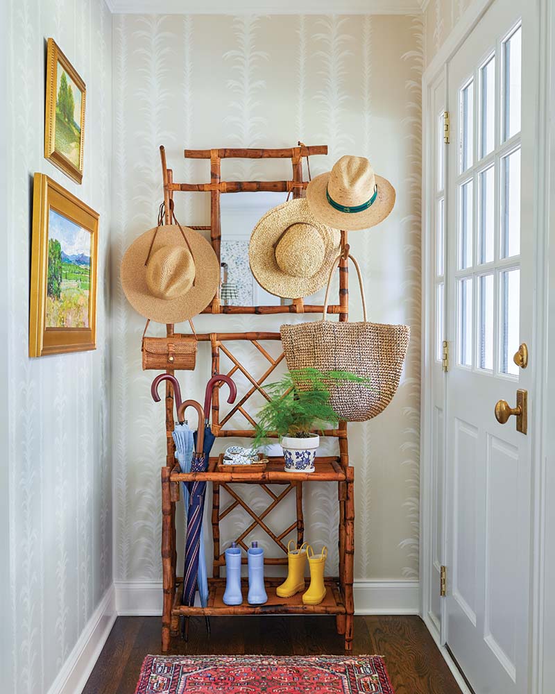 Guests are ushered into a small, stylish entryway that makes the most of every inch of space.