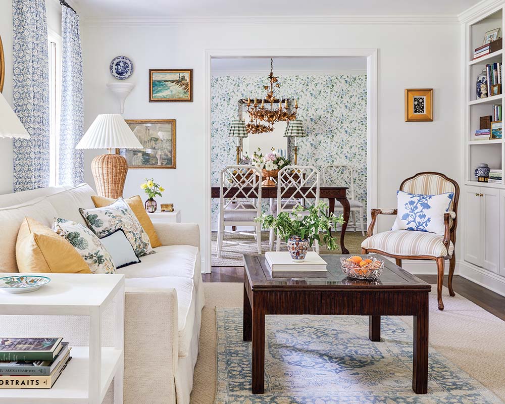 Incorporating artwork that holds some sort of sentiment—even if just representative of a special place or location—was a key factor for the couple. In the living room, a painting featuring sailboats reminds them of their wedding reception at the yacht club in Bailey’s hometown of Fairhope, Alabama. Above it is a painting that inspires fond memories of an anniversary trip to California.