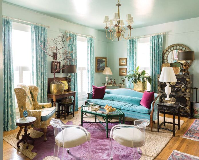 Lucite chairs, a lacquered Oriental cabinet, and an eccentrically printed yellow-and-turquoise armchair may not seem like pieces that belong in the same room, but Mary Nelle’s vision makes it appear as though they were never meant to be anywhere else. Whimsy abounds in the space, grounded by classic landscapes, antique tables, and the neutral foundation of a sisal rug.