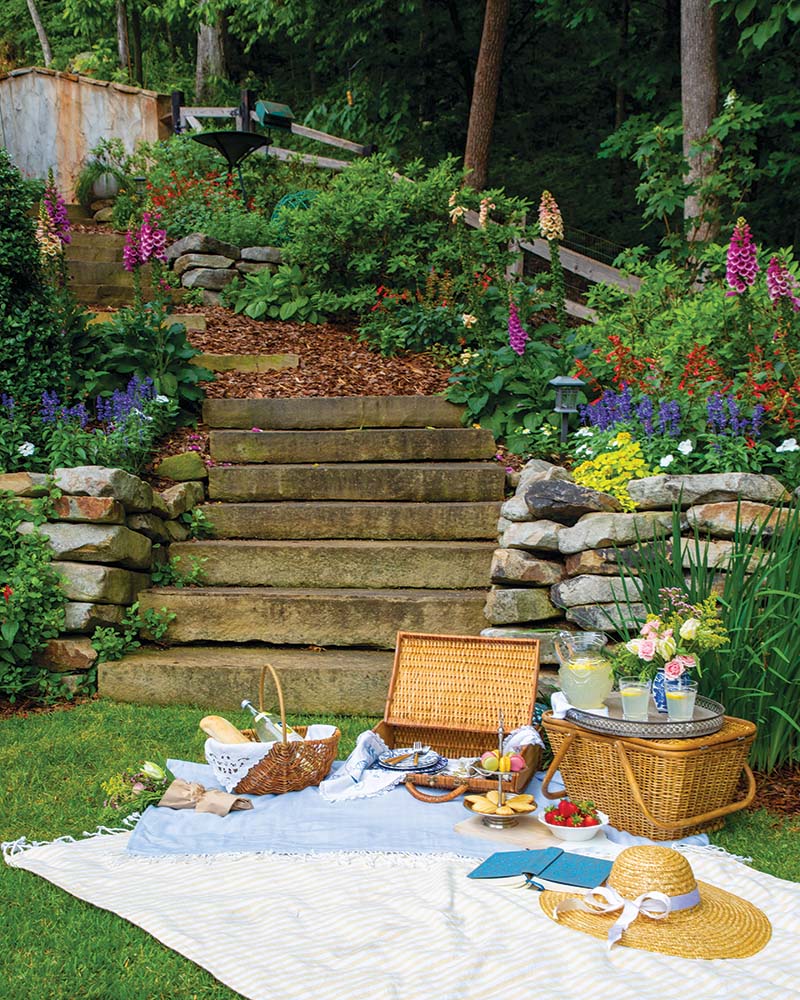 An Alabama homeowner transforms the steep, grassy slope of her backyard into a tiered garden that serves as a delightful retreat.