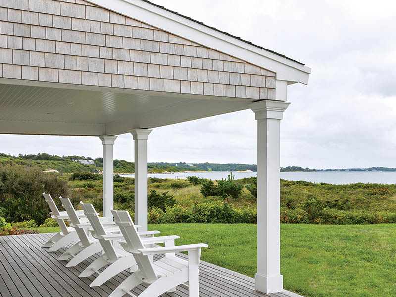 Beyond the classic gray-shingled, cottage-style exterior, the outdoor areas remain another favorite hangout of the family—from the welcoming front porch lined with Adirondack chairs to the comfortably furnished deck.