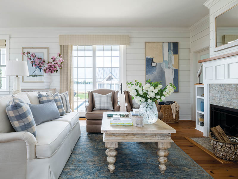 Painted beaded lap-siding walls and warm pine floors enhance the cottage’s cozy look.