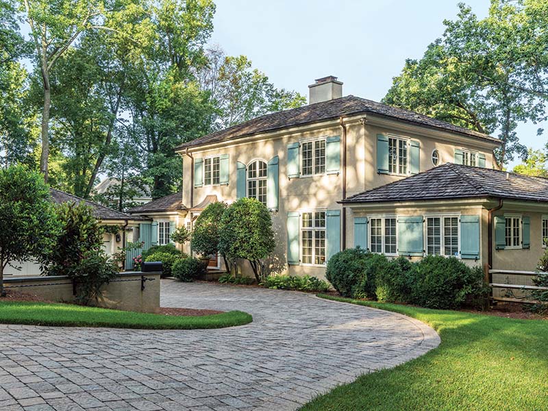 When Thomas retired as president, the university gave the couple a site adjacent to the Hanes House property to build their own home.