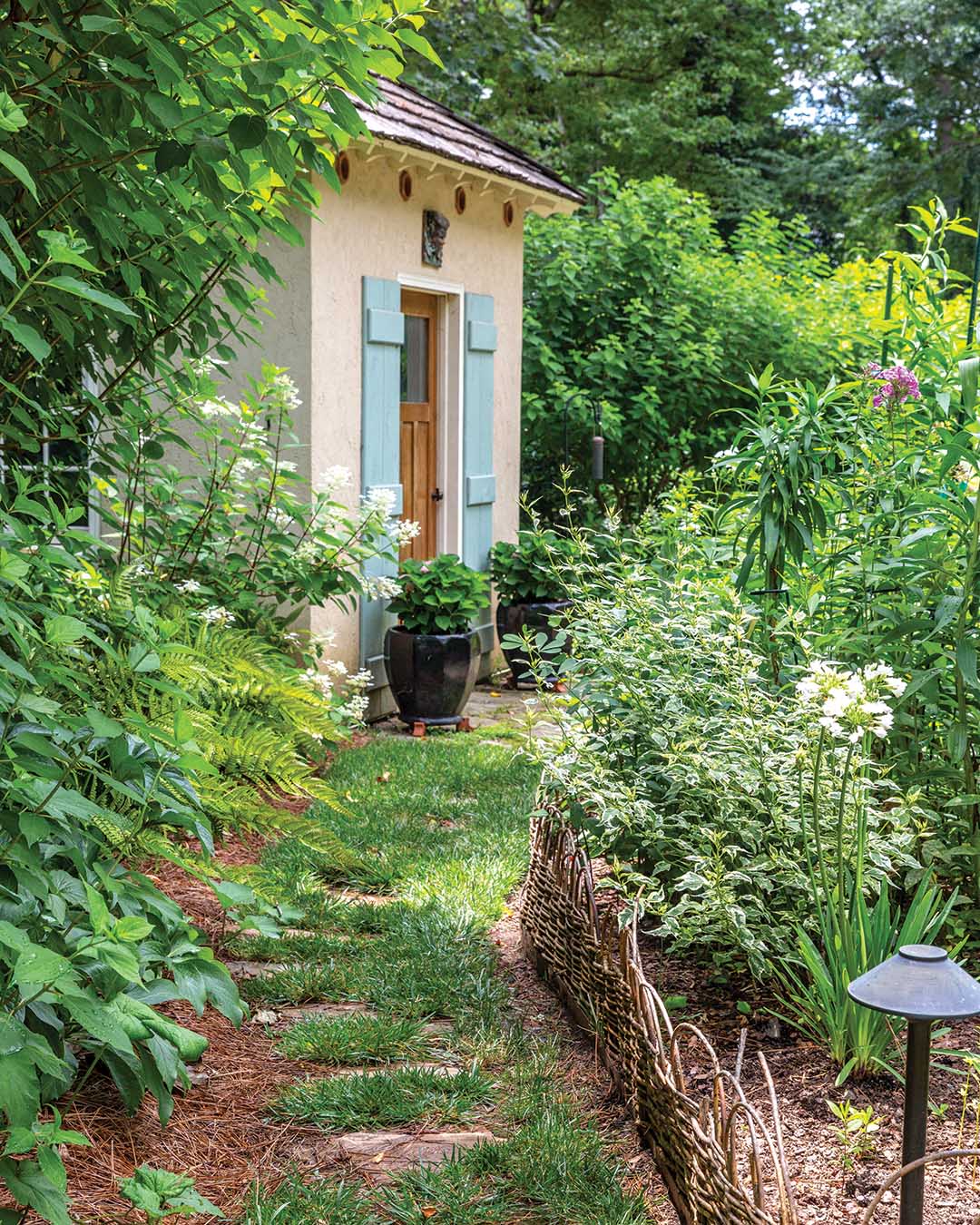 Breathing in fragrant floral scents or strolling through the circuitous wooded paths of Laura Hearn’s garden, you feel the sense of historic inspiration revived by a fresh outlook, thanks to her longtime collaboration with landscape architect Chip Callaway.