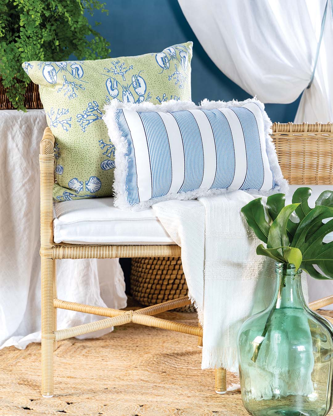Bench and cushion from Serena & Lily. Lobster pillow from Maine Cottage. Striped pillow from Frontgate.