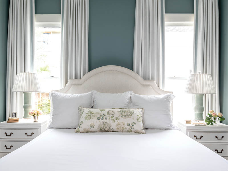 The primary bedroom is a cozy spot for relaxation.