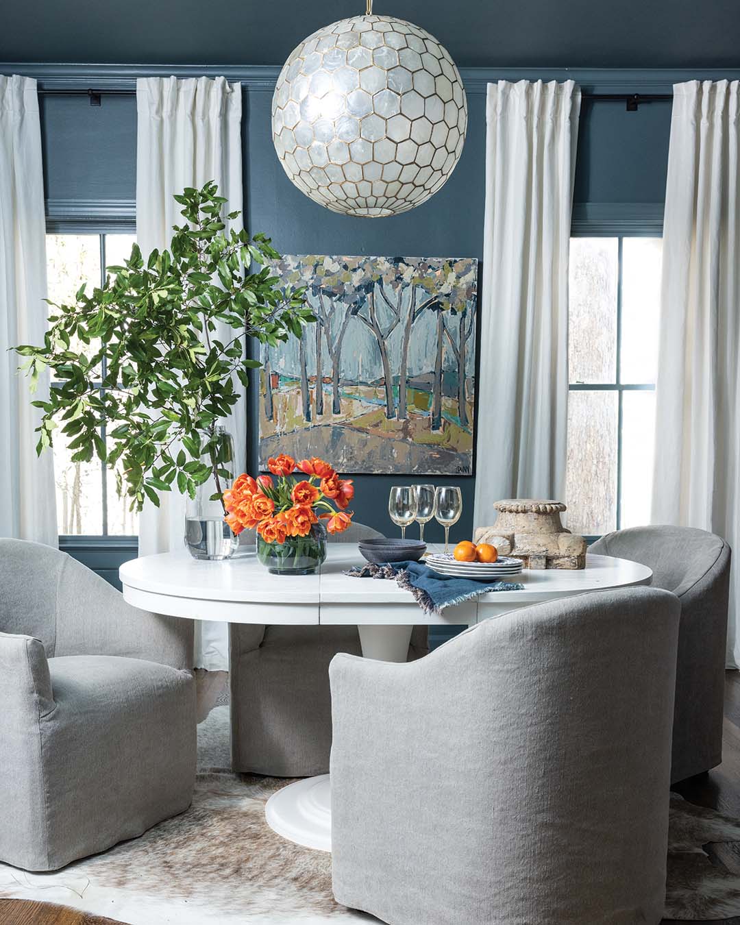 Leigh integrated shades of blue throughout the home, going richer in the dining room.