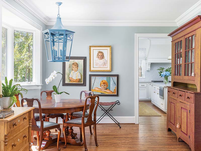 The former kitchen was converted into a breakfast nook nestled within the bay window.