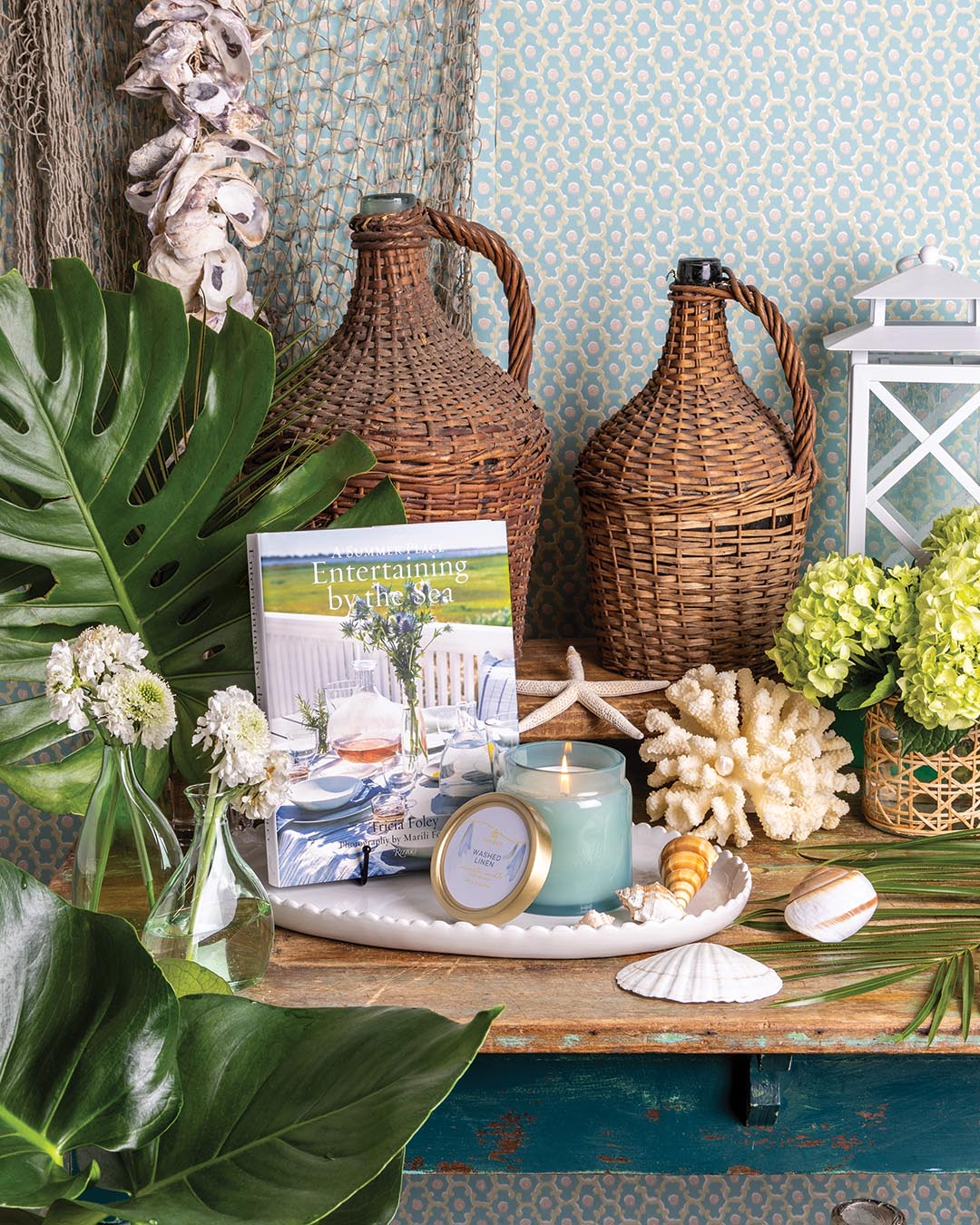 Wallpaper from Little Greene. Demijohn bottles from etúHOME. Book and platter from Brooke & Lou. Candle from Thymes.