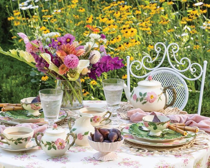 Immerse yourself in the charm of a blooming countryside garden, where the rustic elegance of wildflowers and timeless simplicity converge for a serene dining experience.